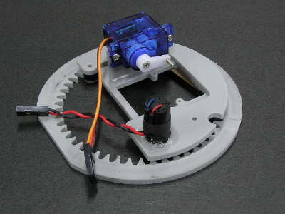 Gun elevation servo and turret motor assembly